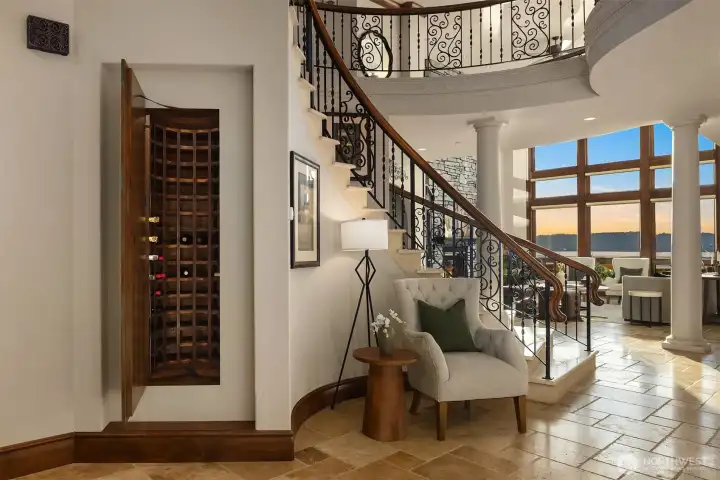 Don't' miss the custom wine cellar with hand painted door, able to store multiple bottles of your favorite wines.