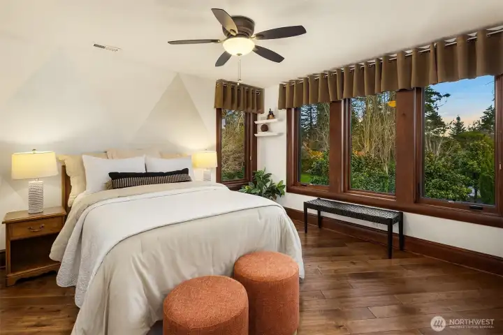 Another beautiful bedroom with delightful and serene views.