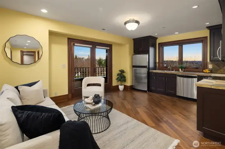 Guest suite/apartment is fully quipped living quarters with custom cabinetry, rear viewing deck and spectacular views of Mt. Rainier, English gardens, and Des Moines Marina.