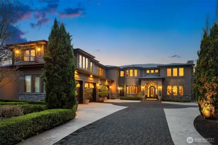 Four car garage with sound system, heated floors, fully finished walls and windows with forty feet of custom built-in storage.