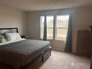 Primary Bedroom is spacious & easily fits a King bed.