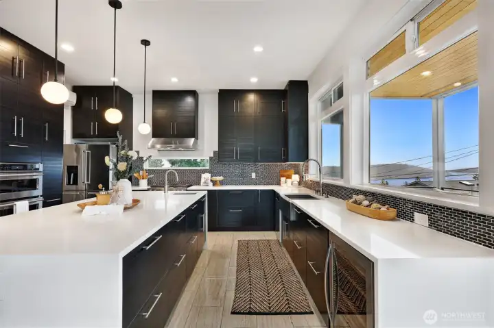 Chef’s kitchen with oversized island and lake views