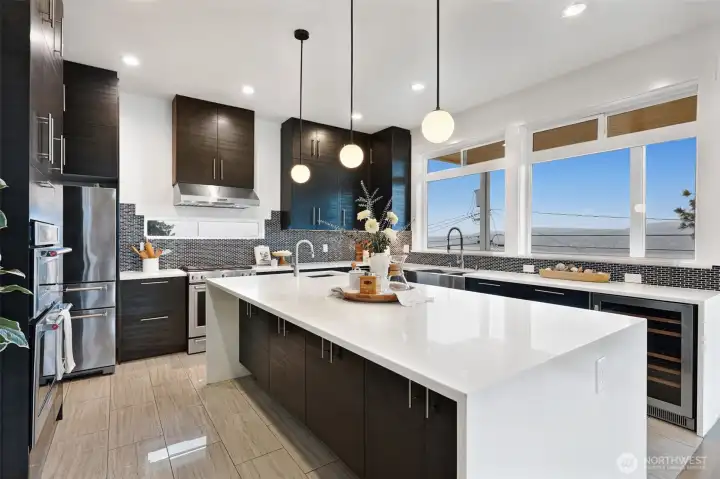 Bright kitchen with expansive windows and quartz counters