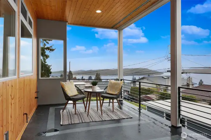 Covered outdoor deck with stunning lake views