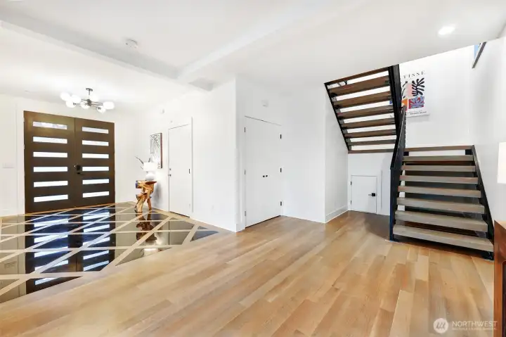 Spacious entry foyer with modern staircase