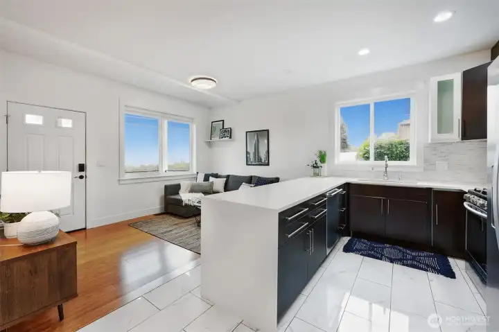 ADU kitchen with modern cabinetry and quartz counters