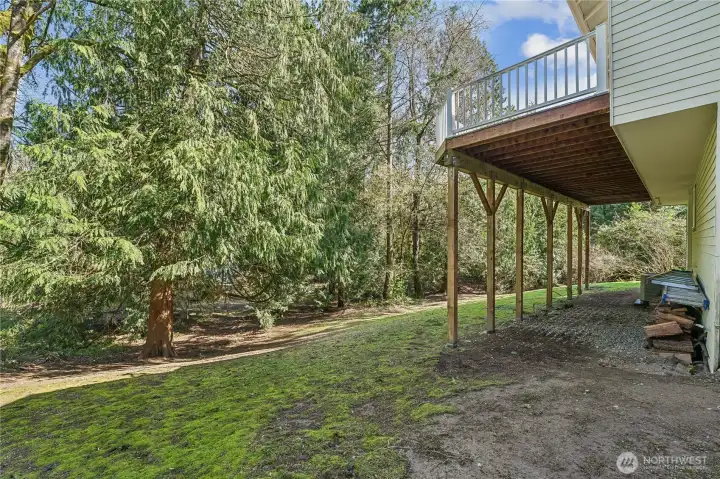 large covered area could be made into a patio for extra outside enjoyment.