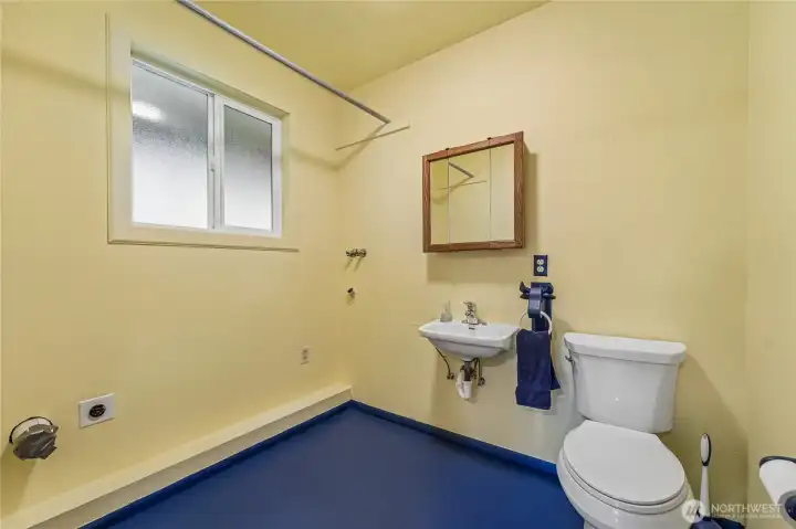 half bath and utility room off lower level bonus room.