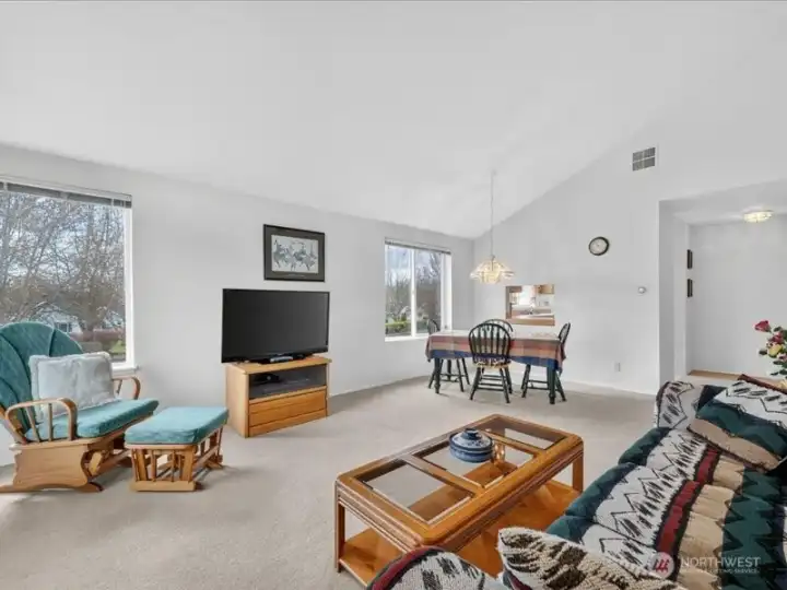 Looking toward the formal dining area and the kitchen beyond. Looking toward the formal dining area and the kitchen beyond.