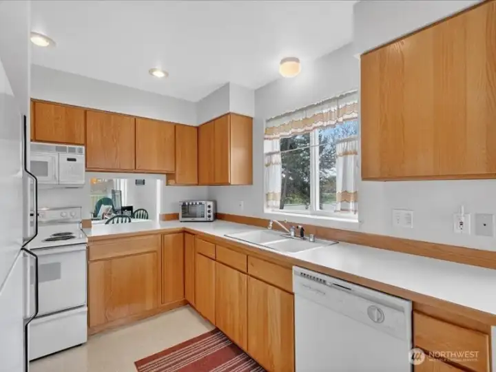 The kitchen sink looks to the west which has fabulous sunset views. The kitchen sink looks to the west which has fabulous sunset views.