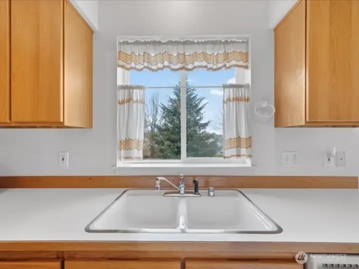 The kitchen sink has beautiful westerly facing views. The kitchen sink has beautiful westerly facing views.