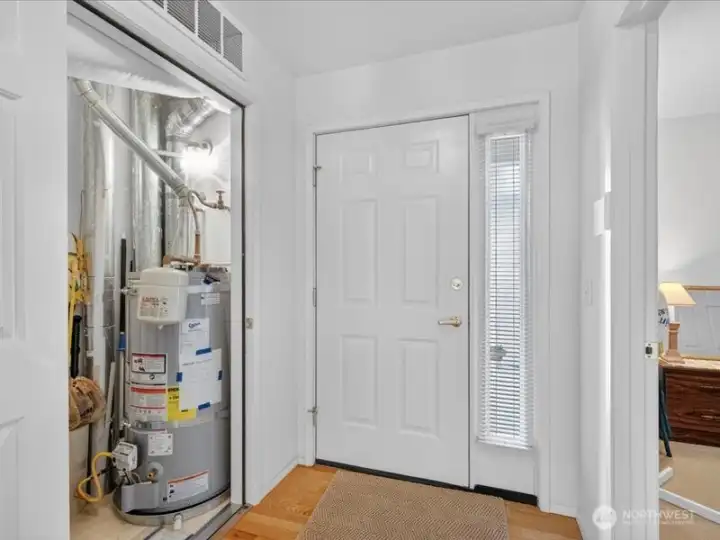 Adjacent to the front entry there is a closet that has the newer gas hot water heater and furnace. Adjacent to the front entry there is a closet that has the newer gas hot water heater and furnace.