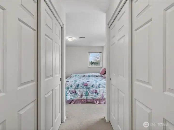 There are large closets on both walls between the primary bedroom and the full bath. There are large closets on both walls between the primary bedroom and the full bath.