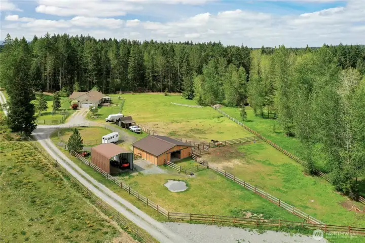 Here it is! The equestrian estate you've been looking for! This drone shot shows SOME of your 20 acres, house, barn, carport, fenced and cross fenced, in a private gated community, come take a look!