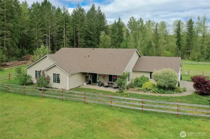 Drone view of the front of the home, located at the end of a dead-end road, you will find this home lovely inside and out. So quiet and private here!