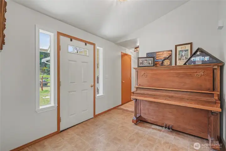 As you enter the home, you will notice how bright and cheery it is, with vaulted ceilings and beautiful flooring throughout.