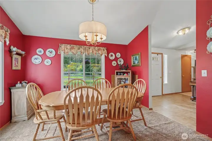 View of your formal dining room, located between the main entry and the kitchen. I LOVE this accent color, so many delicious meals and gatherings here!