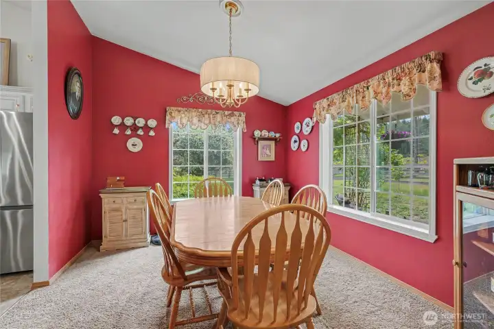 View of your formal dining room from entry towards your kitchen, look at the size of those windows! Not a bad view out of any window in this home.