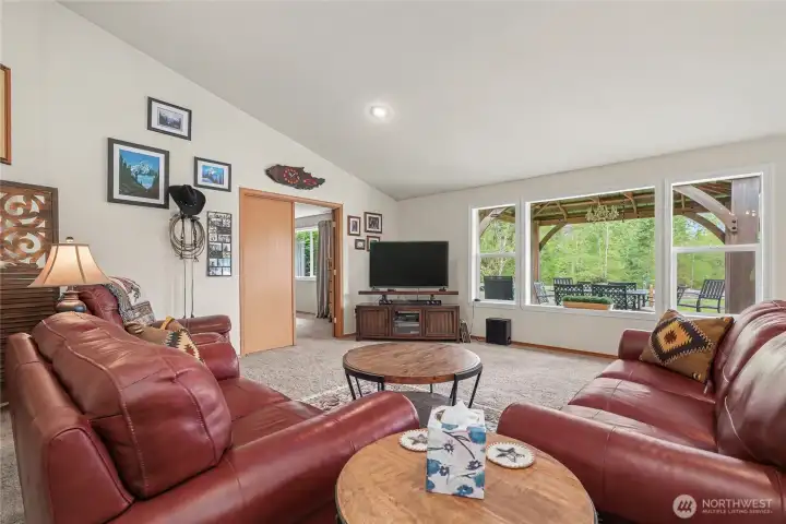 Family room view, I love the open feel and large windows, French Doors to your primary suite upper left.