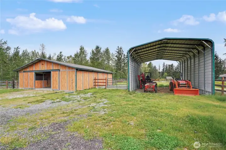 View of your humongous carport and 2-year old horse/livestock barn! WOW.