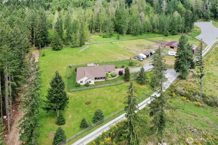 Drone view as you head down the road to the property, only one neighbor to your right down a spell.
