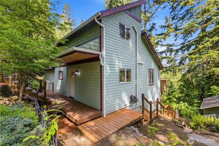 Thoughtfully designed pathways and decks connect the home seamlessly to the outdoors.