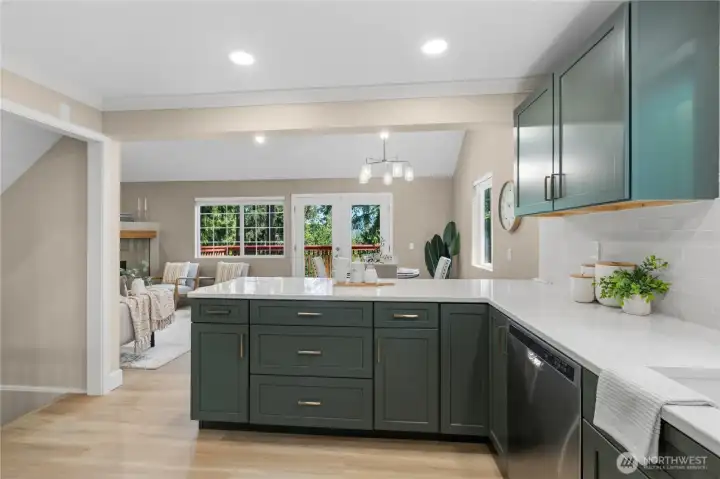 Fully remodeled kitchen with modern cabinetry, quartz countertops, and a functional open layout.