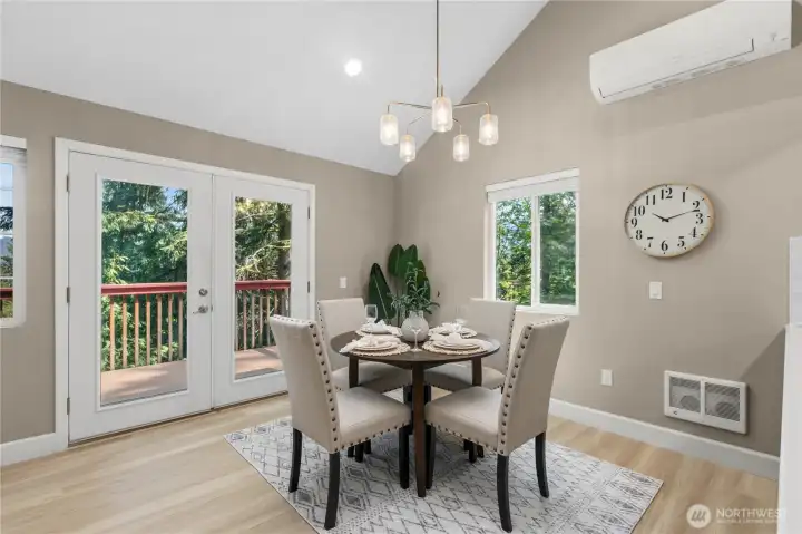 Light-filled dining space with direct access to the deck for indoor-outdoor living.
