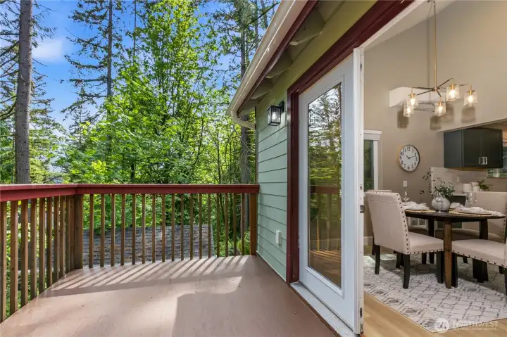 Private deck surrounded by mature evergreens, creating a peaceful space to relax, unwind, or enjoy fresh mountain air.