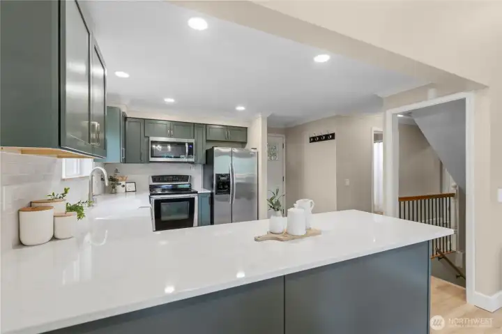Modern finishes paired with warm natural tones create an inviting Northwest-inspired design.