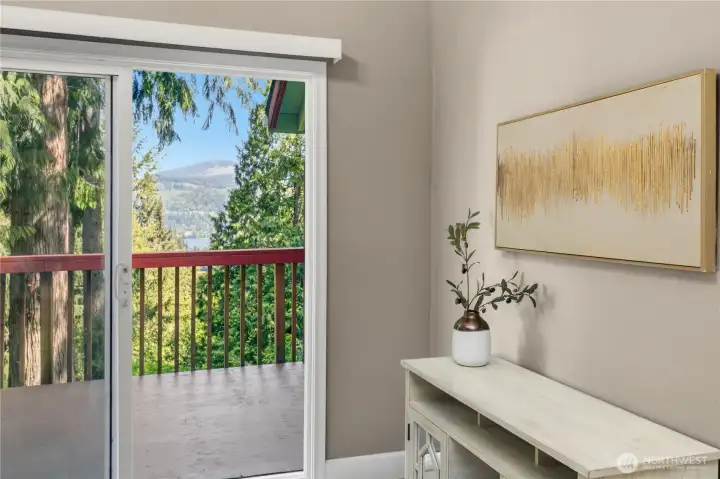 Private primary bedroom deck offers peaceful treetop views and a quiet connection to the surrounding natural landscape.