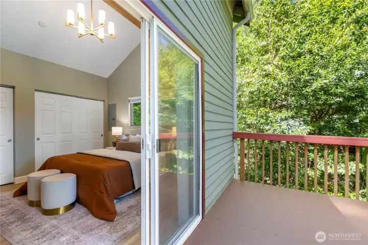 Deck off the primary bedroom provides a relaxing setting to enjoy wooded views and filtered glimpses of Lake Whatcom and surrounding hillsides.