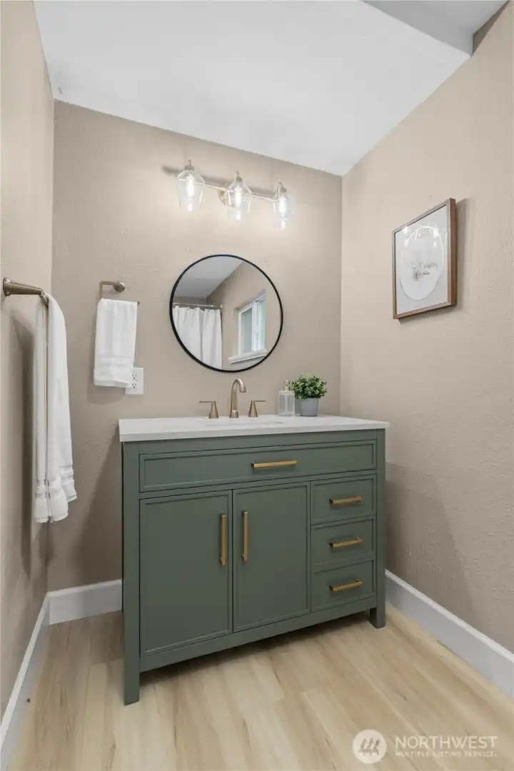 Updated vanity and fixtures add a fresh, modern feel to the bathroom space.