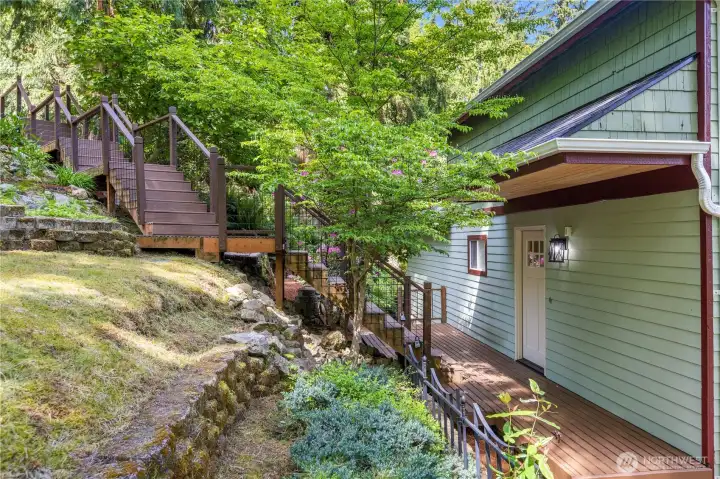 Mature landscaping and terraced garden spaces blend naturally into the surrounding environment.