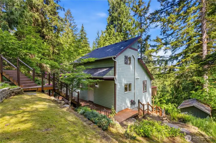 Elevated entry walkway creates a warm approach to this beautifully updated Sudden Valley home.