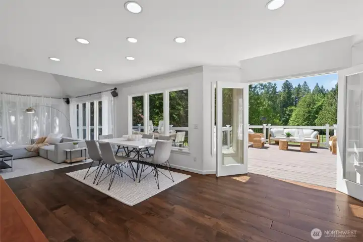 Dining space and family room off the kitchen with scenic views that bring the outdoors in.