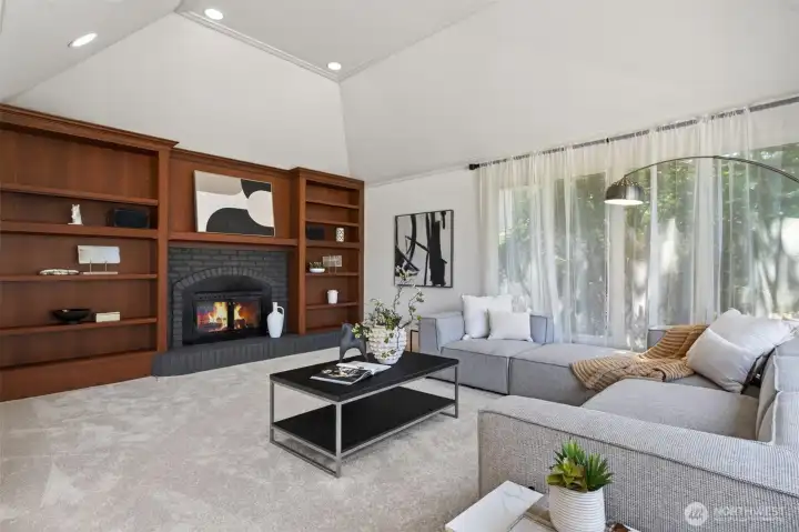 A cozy fireplace creates a welcoming atmosphere in the family room.