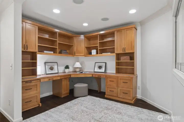 Private office with built-in cabinetry, off the primary bedroom.