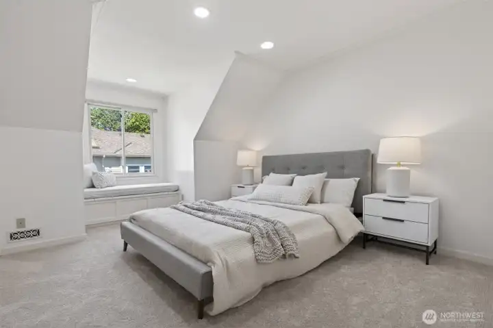 Additional bedroom with golf course view and built-in bench seating.