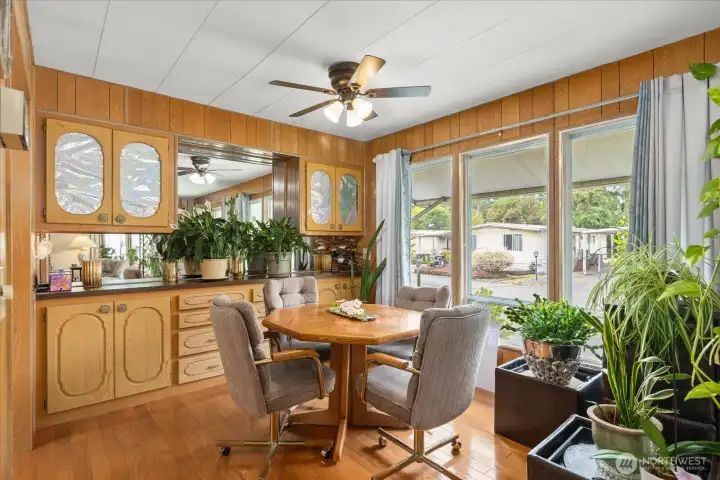 Dining area located off the kitchen and living room, featuring built-in cabinetry for additional storage.