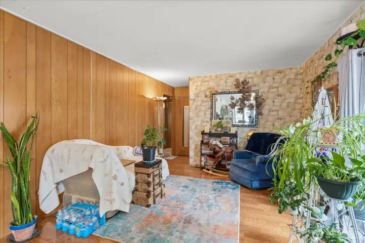 This space offers versatile usage, perfect as a cozy reading nook or a dedicated TV room.