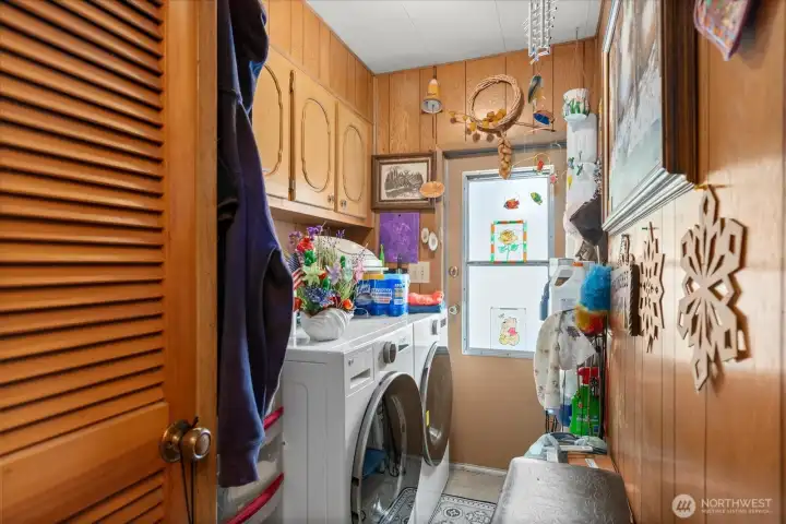Laundry room featuring a convenient side yard entrance.