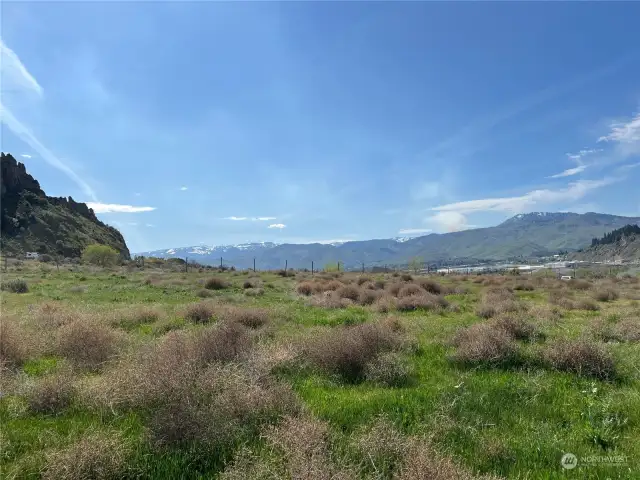 This photo looks South towards Wenatchee with Mission Ridge ski area in the background.  Location of this photo from the eastern edge of the cherry orchard could make ideal home setting.  Zoning code allows several more homes on this land