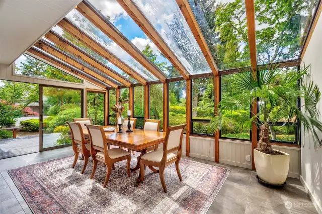 Large solarium dining room off kitchen leading to back deck for easy entertaining.