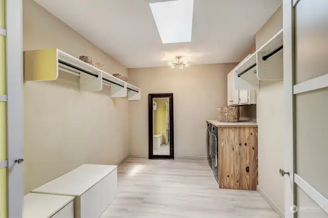Light-filled closet with convenient washer/dryer
