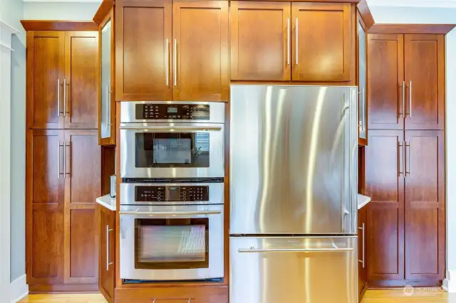 So much great storage space in these custom designed cabinets!  Jenn Air stainless fridge, oven, and microwave.