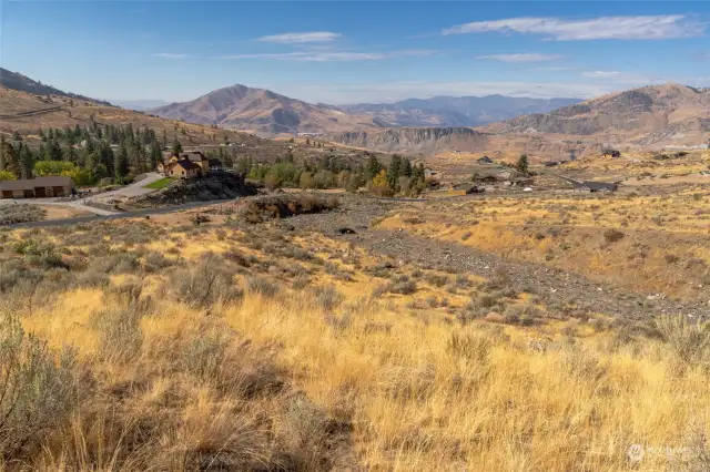 Below the building pad, looking West to the Cascade Mountain Range and Lake Chelan.