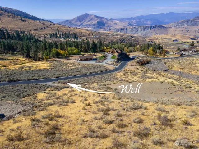 Shared well is located beside the current driveway.