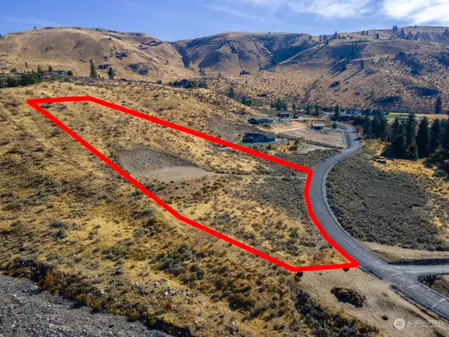 A great view of the amount of room you have below the building pad. With a little grading and dirt work, you could add a shop or possibly a horse pasture.