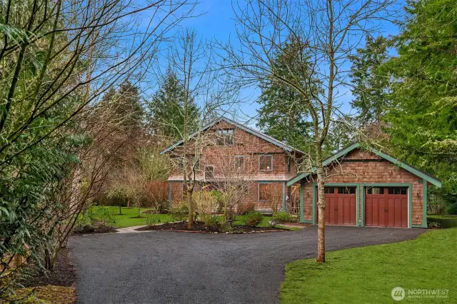 You will never grow tired of this approach to your lovely home. The garage is supersized with a full shop on the west end.